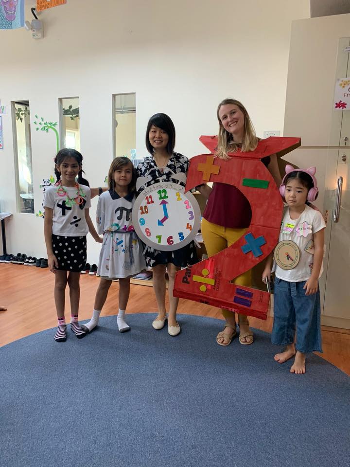 teachers with students in math outfits