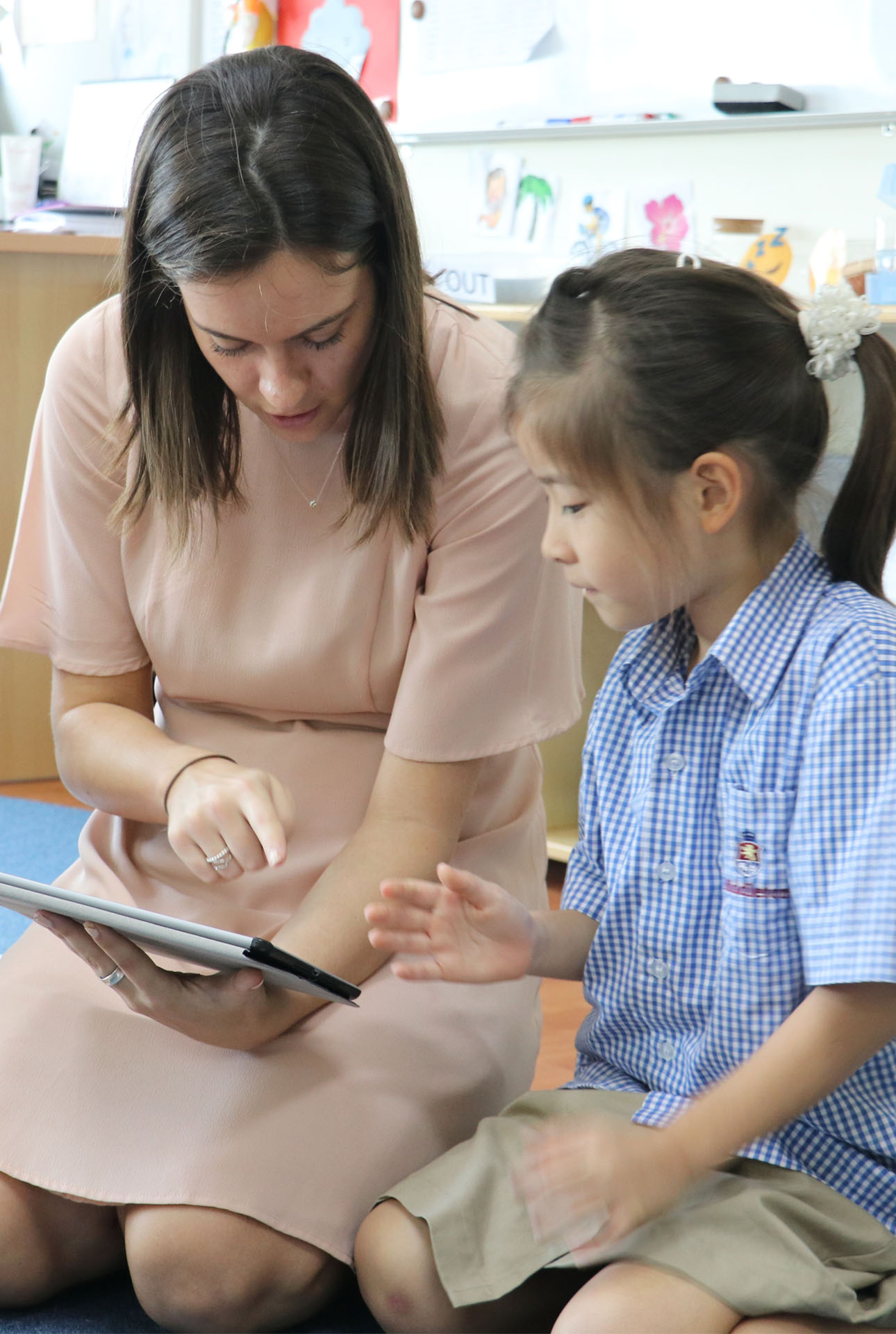 Teacher reading with student