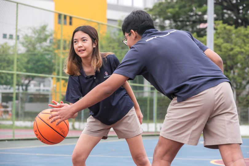 Students playing basketball