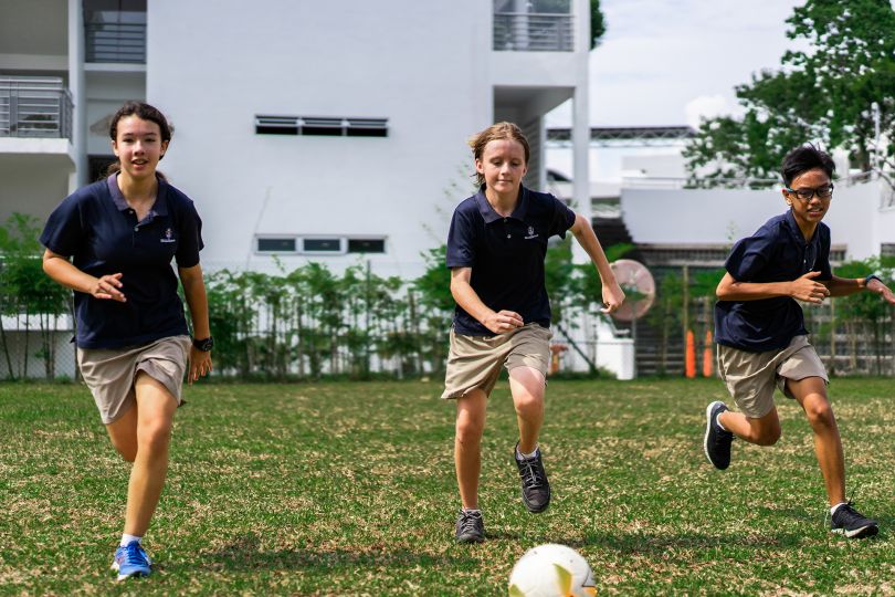 International School Students Playing Soccer