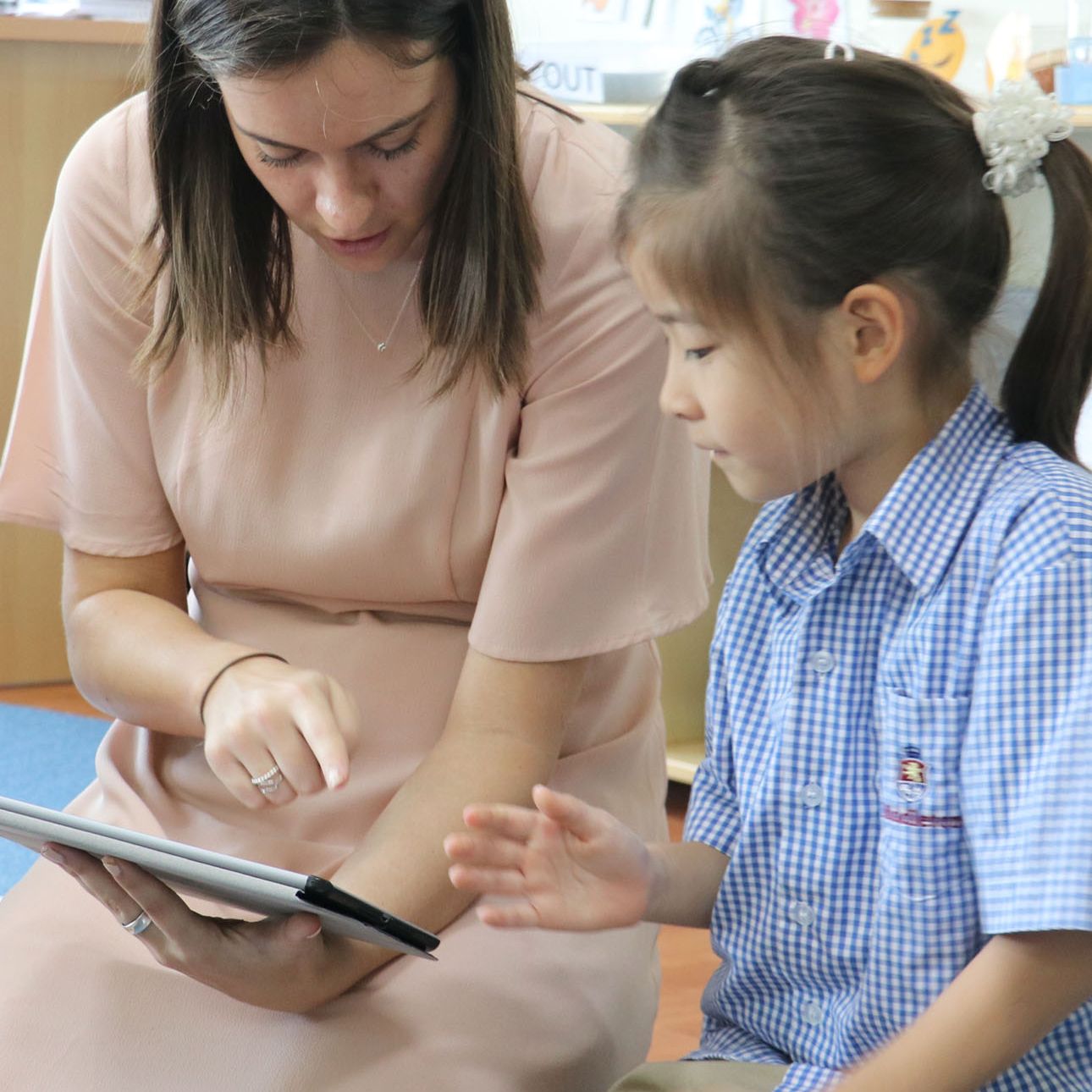 Teacher reading with student