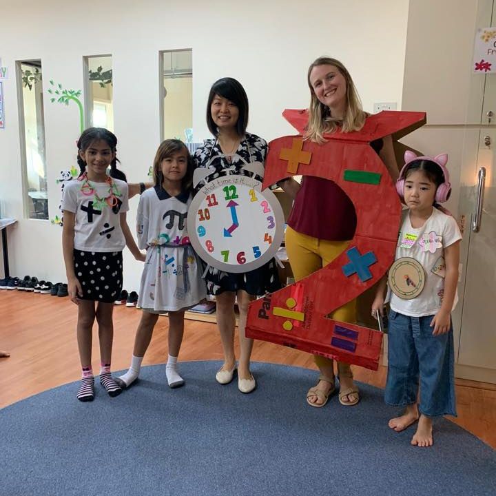 teachers with students in math outfits