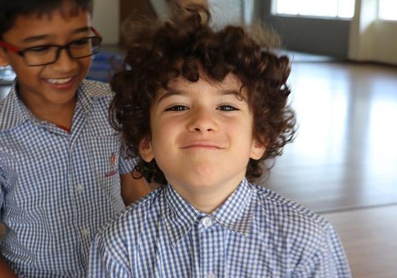 Children smiling at camera
